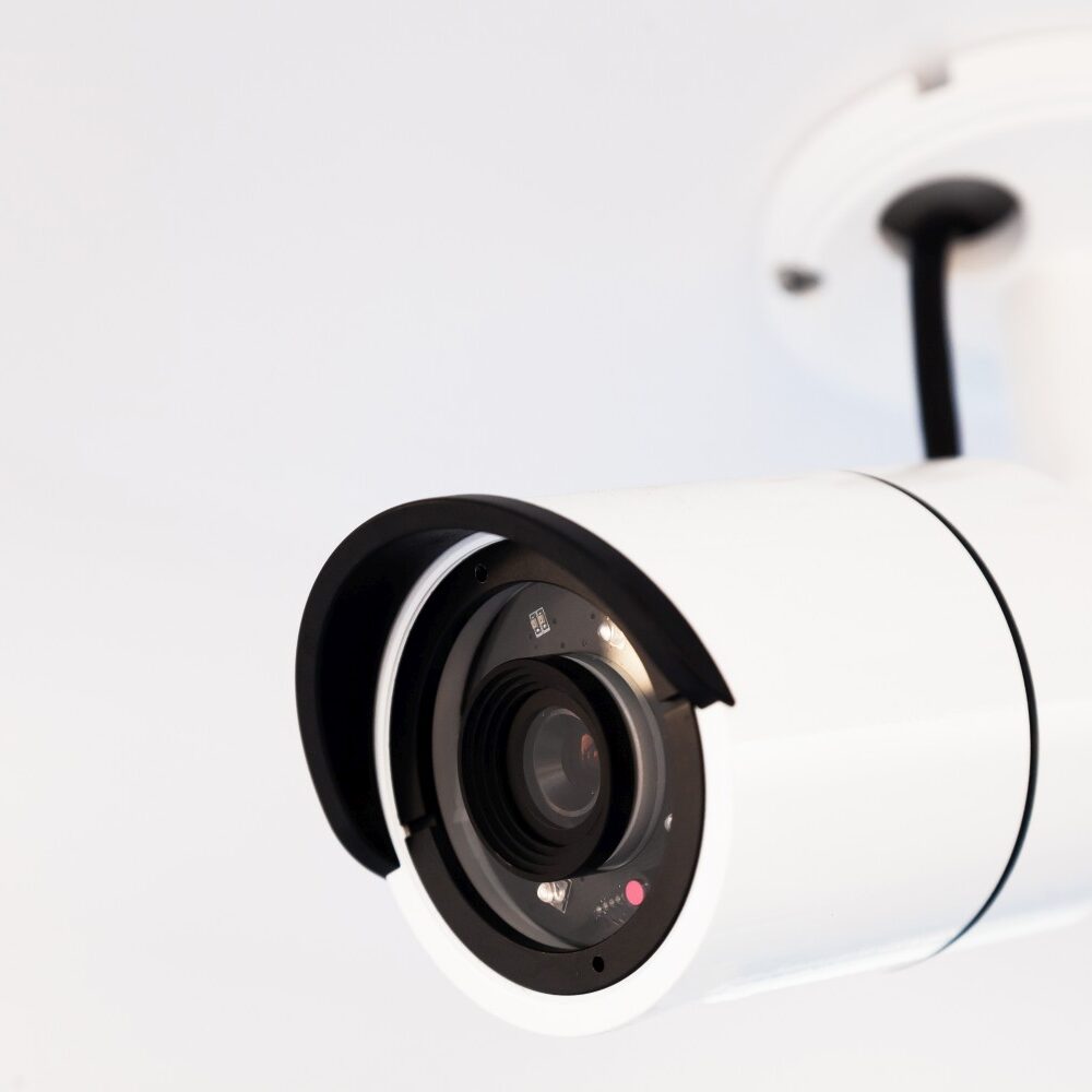 CCTV camera on the hull of an expensive motor yacht. CCTV camera white on a white body.